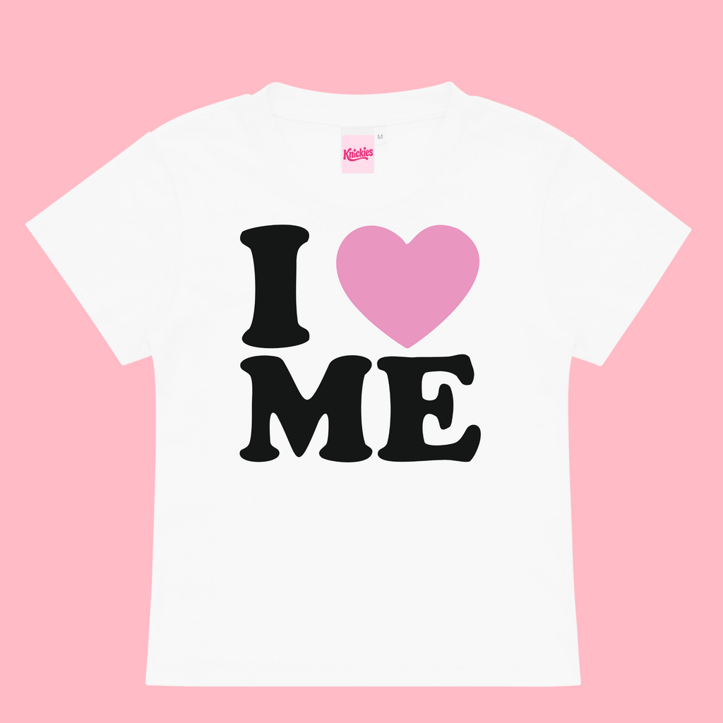 White t-shirt with 'I ❤️ ME' text on a pink background