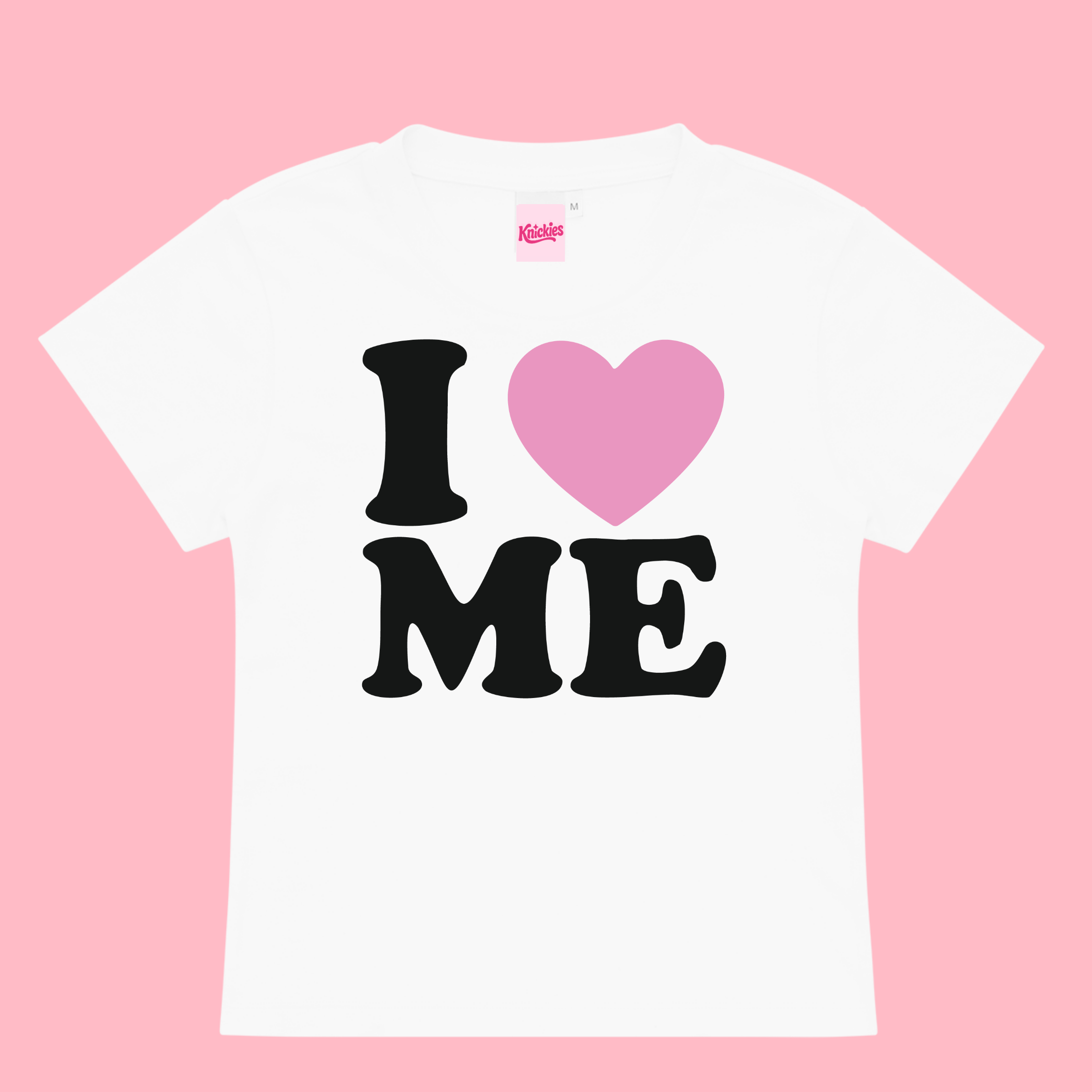 White t-shirt with 'I ❤️ ME' text on a pink background