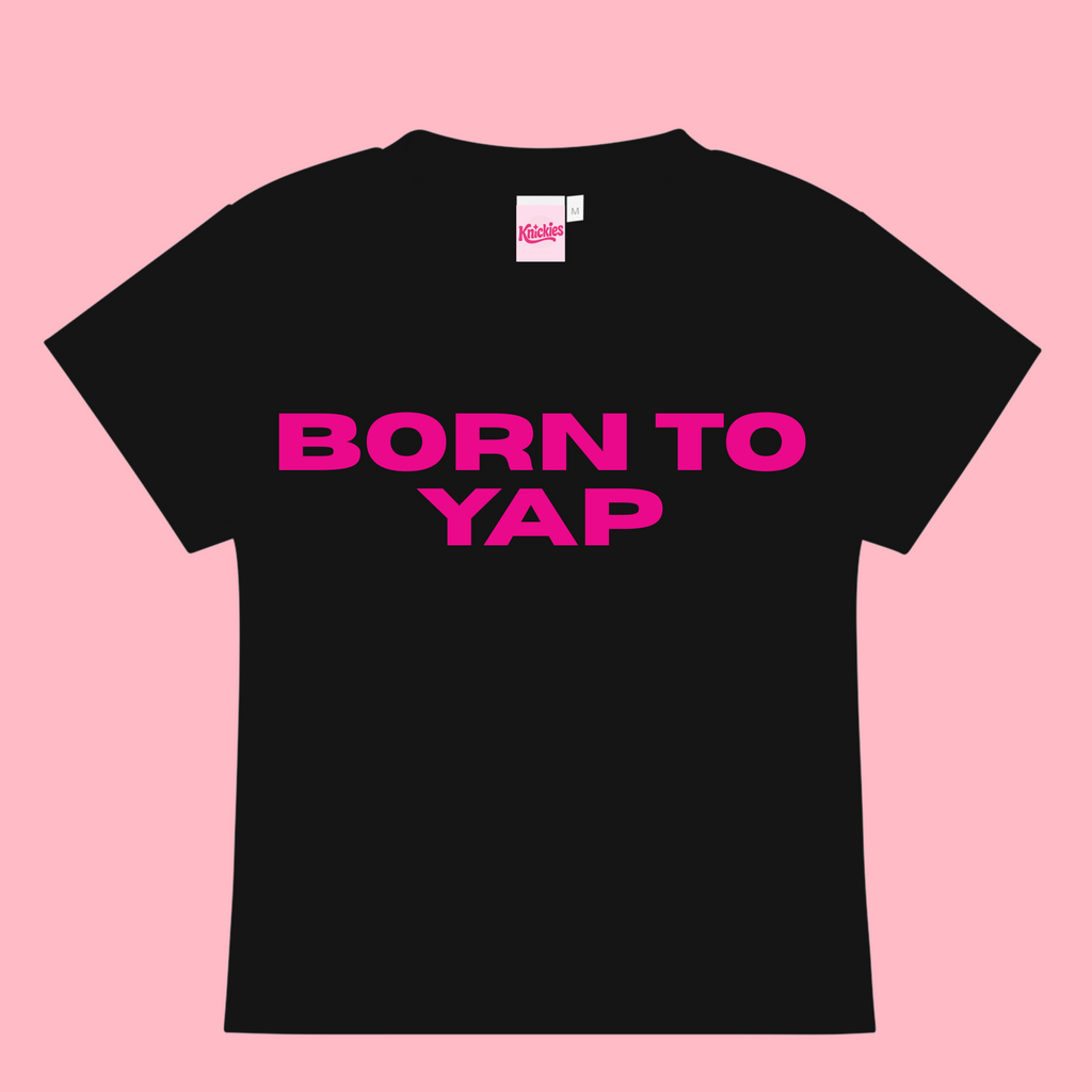 Black t-shirt with 'BORN TO YAP' in pink on a pink background