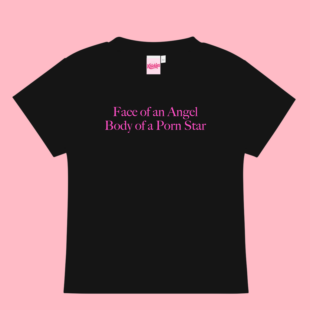 Black t-shirt with pink text on a pink background