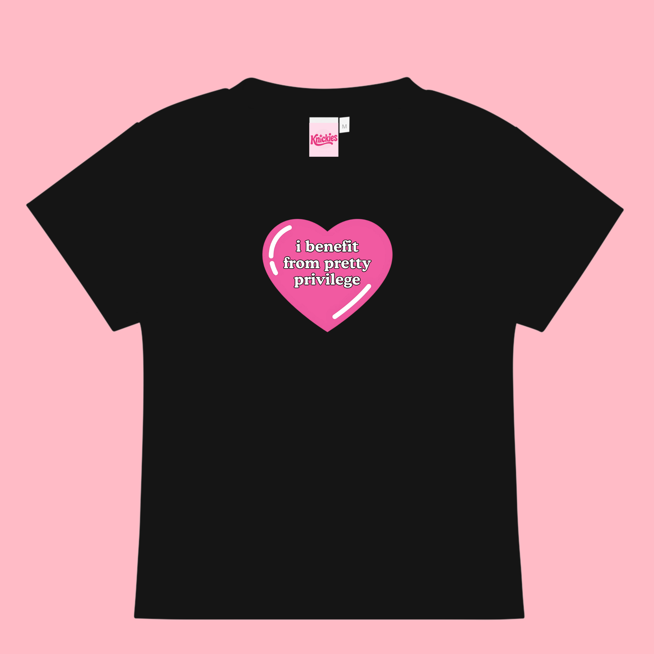 Black t-shirt with a pink heart graphic and text on a pink background