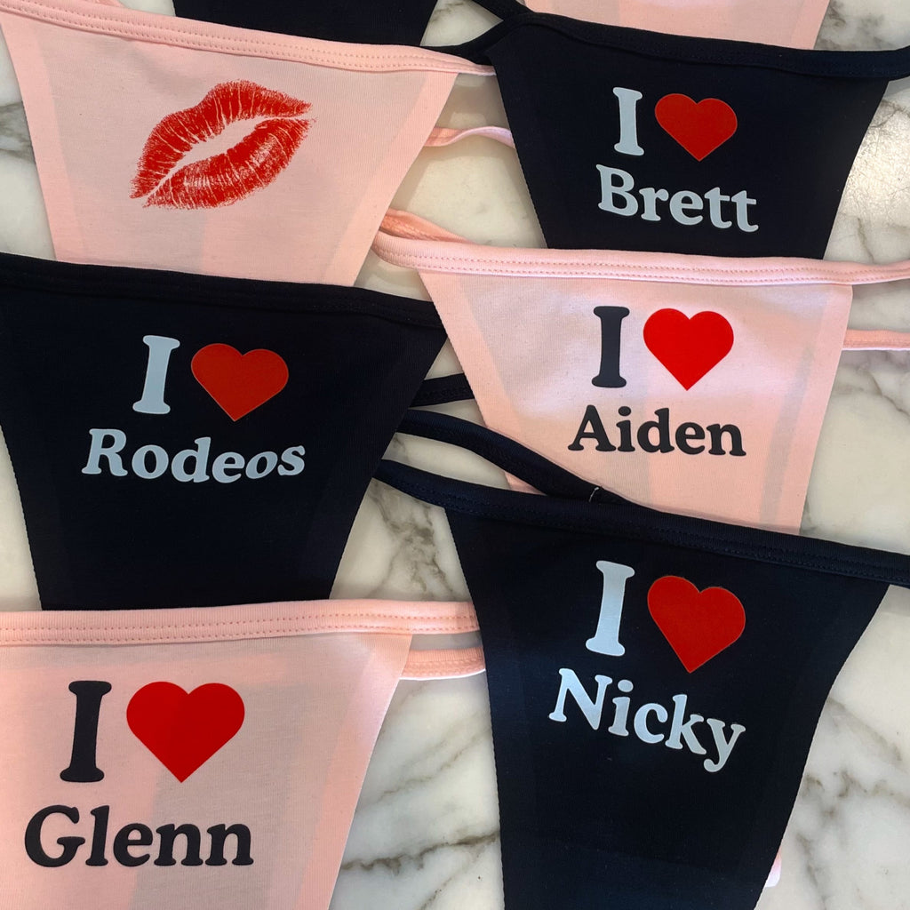 Personalized lingerie sets with names printed on a marble surface