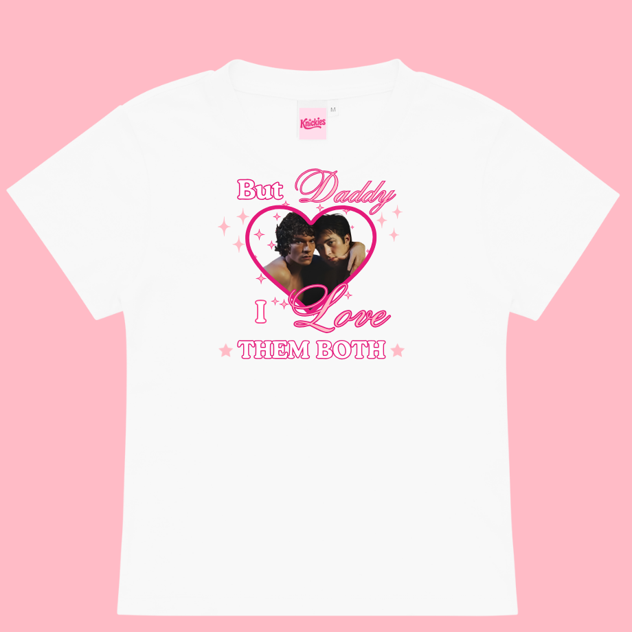 White t-shirt with graphic design on a pink background