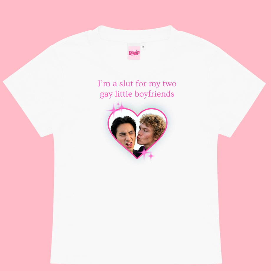 White t-shirt with graphic design and text on a pink background