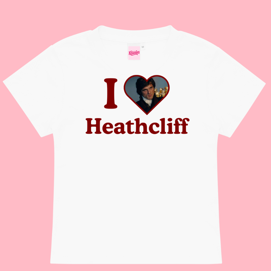 White t-shirt with 'I ❤️ Heathcliff' design on a pink background