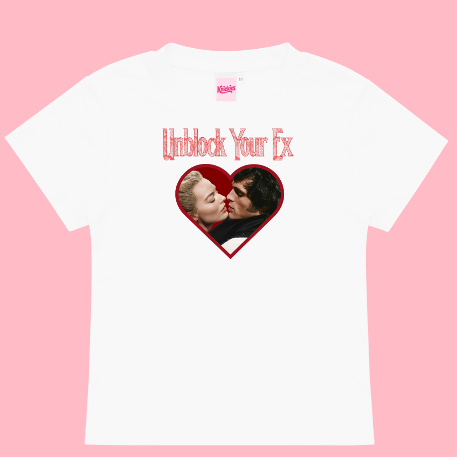 White t-shirt with a graphic of two people kissing in a heart shape and text 'Unblock Your Ex' on a pink background.