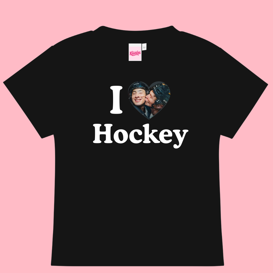 Black t-shirt with 'I ❤️ Hockey' text and a heart-shaped photo on a pink background