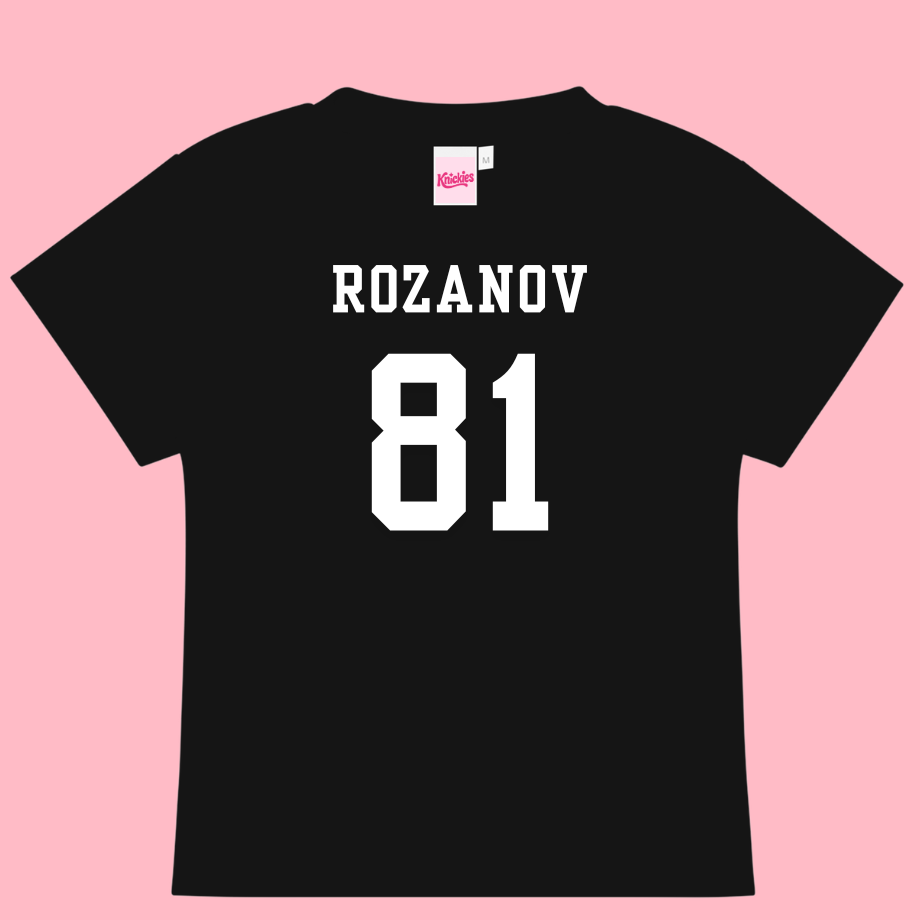 Black t-shirt with 'ROZANOV 81' printed on the back against a pink background